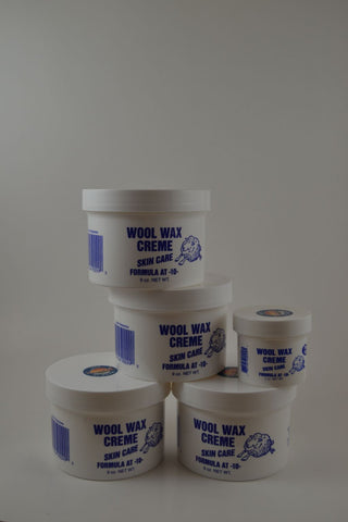 4 Nine ounce jars and 1 two ounce jar Wool Wax Creme